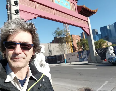 marcos meneghetti in front of the chinatown gate in Montreal
